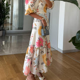 CAMILLE – BLOEIENDE ELEGANTIE JURK MET PUFFMOUWEN