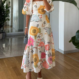 CAMILLE – BLOEIENDE ELEGANTIE JURK MET PUFFMOUWEN