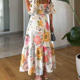 CAMILLE – BLOEIENDE ELEGANTIE JURK MET PUFFMOUWEN
